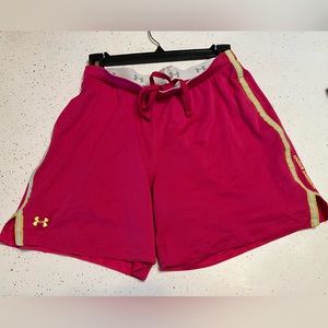 Under Armour athletic shorts, pink with yellow stripe, size small